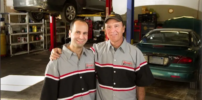 Two auto shop owners in their garage